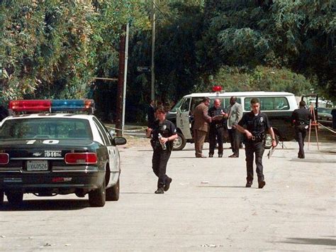 Police outside the Encino home of comedic actor Phil Hartman.
